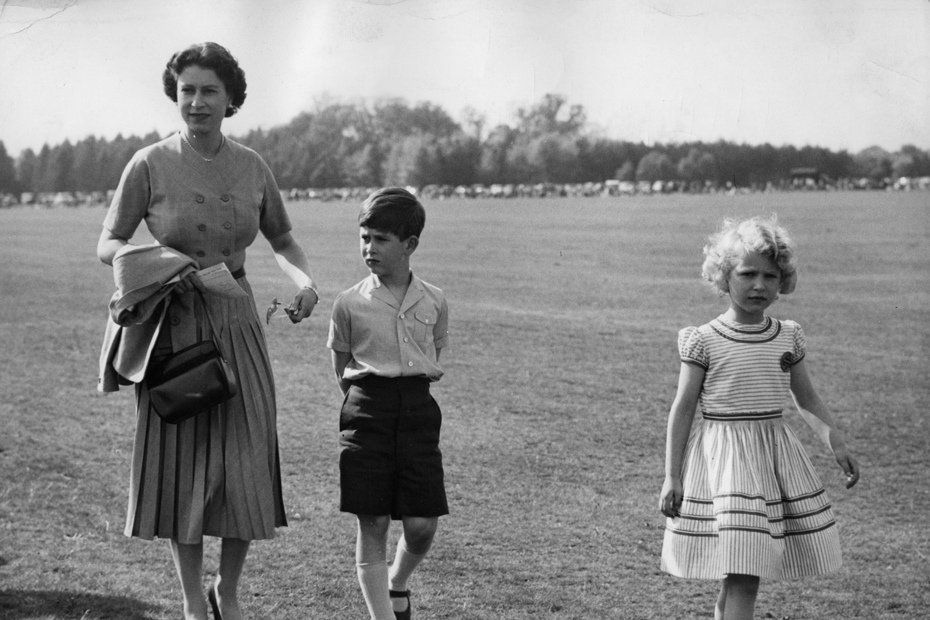 The Queen with Charles and Anne in 1956 (PA)