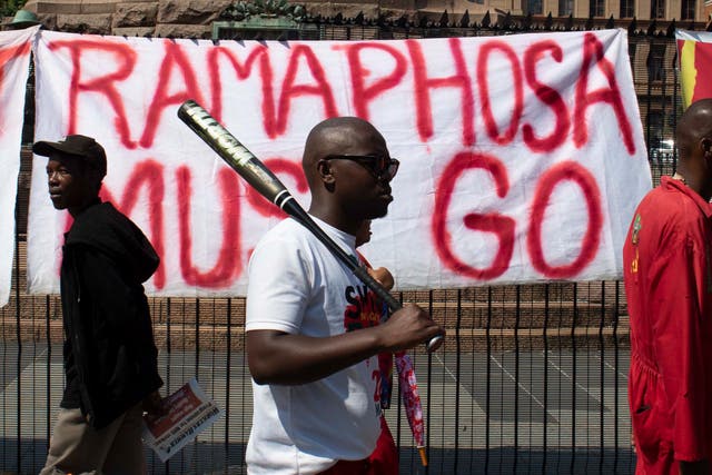 <p>EFF supporters march against Cyril Ramaphosa in Pretoria</p>
