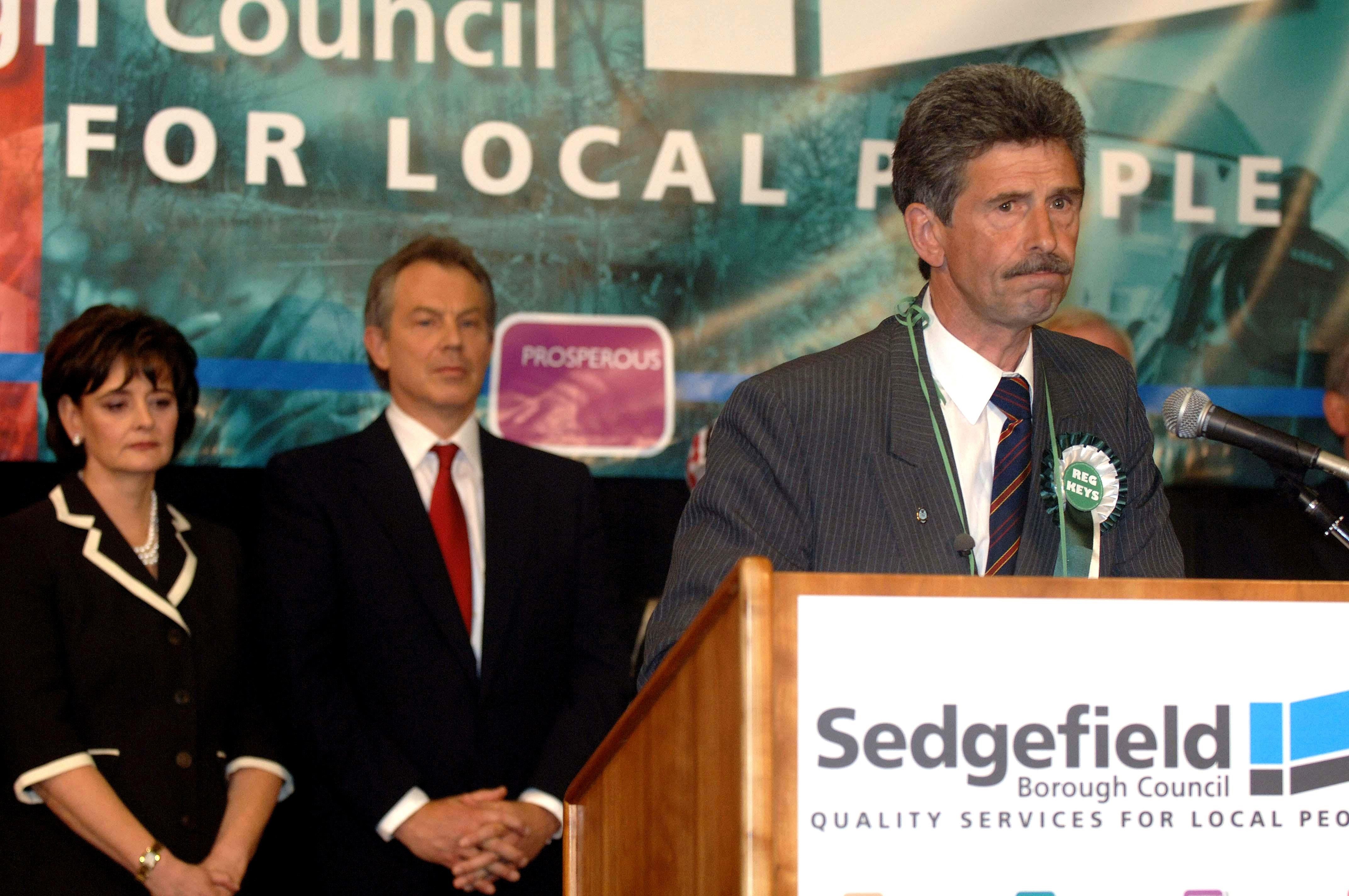 Prime Minister Tony Blair watches Reg Keys, who stood against him as an Independent in Sedgefield, speak after the result confirmed his re-election