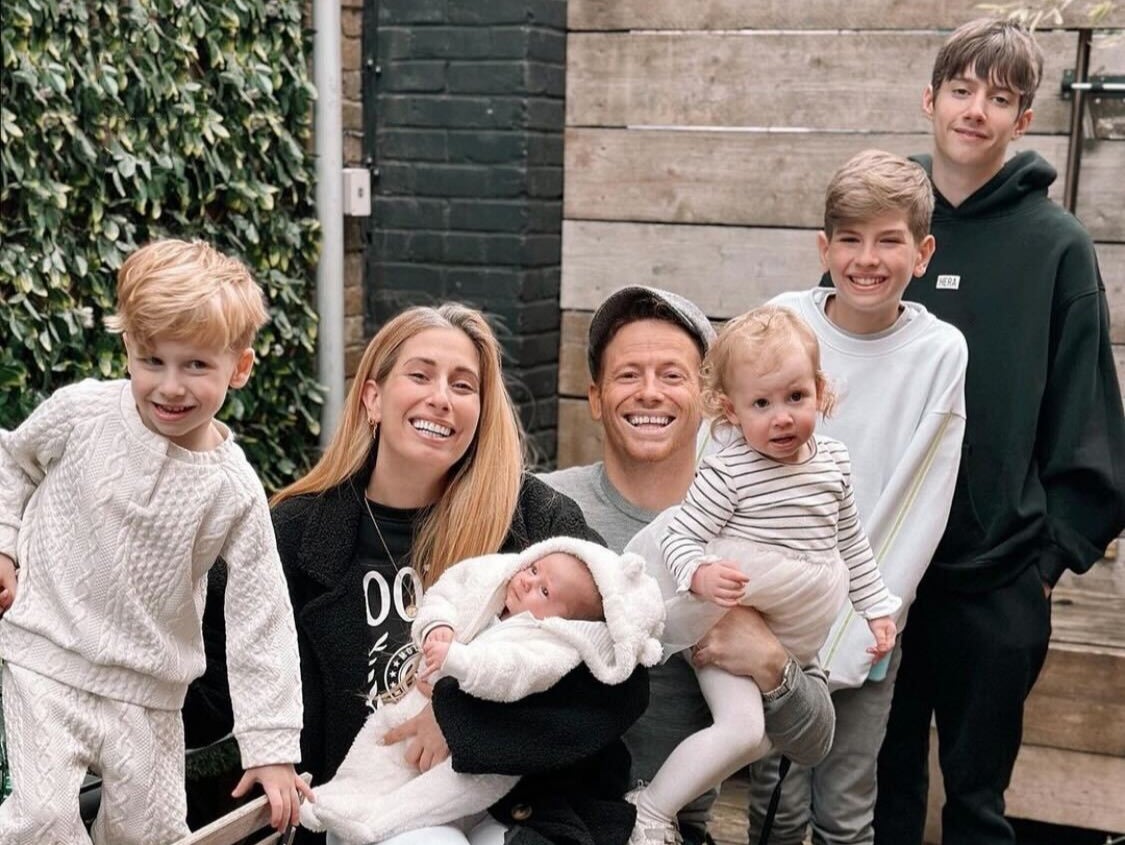 Stacey Solomon and Joe Swash pose with five of their children
