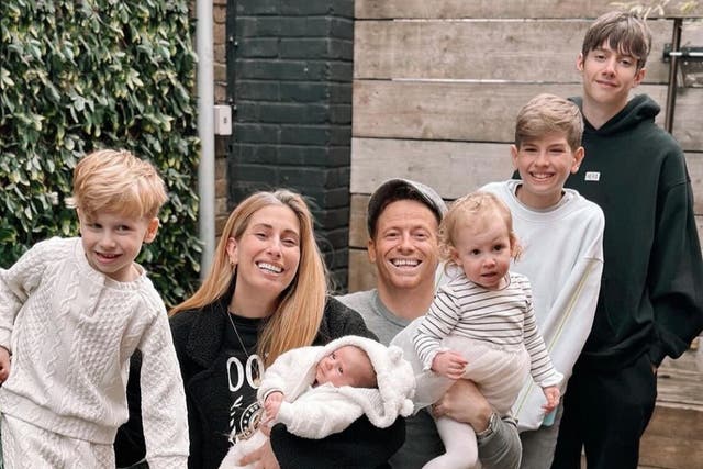 <p>Stacey Solomon and Joe Swash pose with five of their children</p>