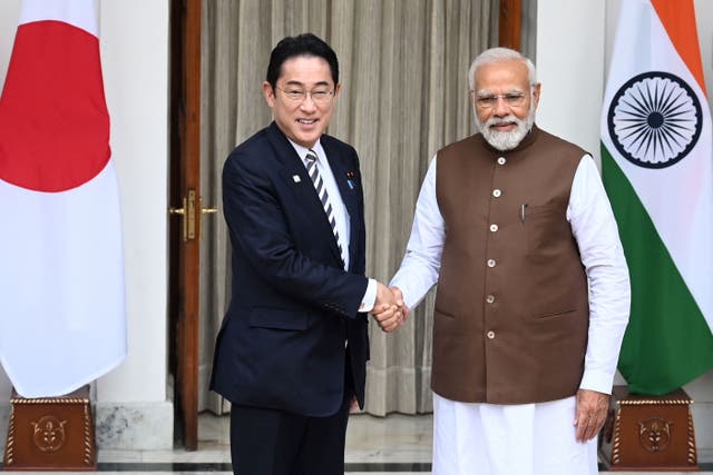 <p>Japan’s Prime Minister Fumio Kishida (left) shakes hands with his Indian counterpart Narendra Modi before their meeting at the Hyderabad House in New Delhi on 20 March </p>