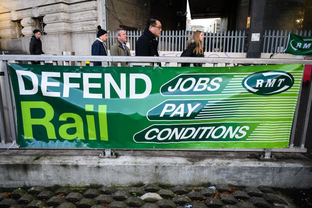 <p>An RMT union banner at Waterloo station in London</p>