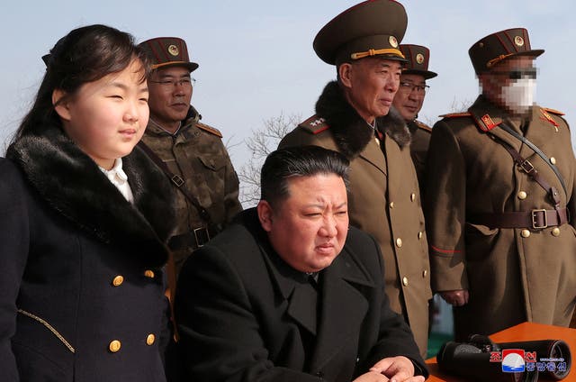 <p>Kim Jong-un and his daughter Kim Ju-ae watch a missile drill at an undisclosed location in this image released by North Korea’s Central News Agency on 20 March</p>