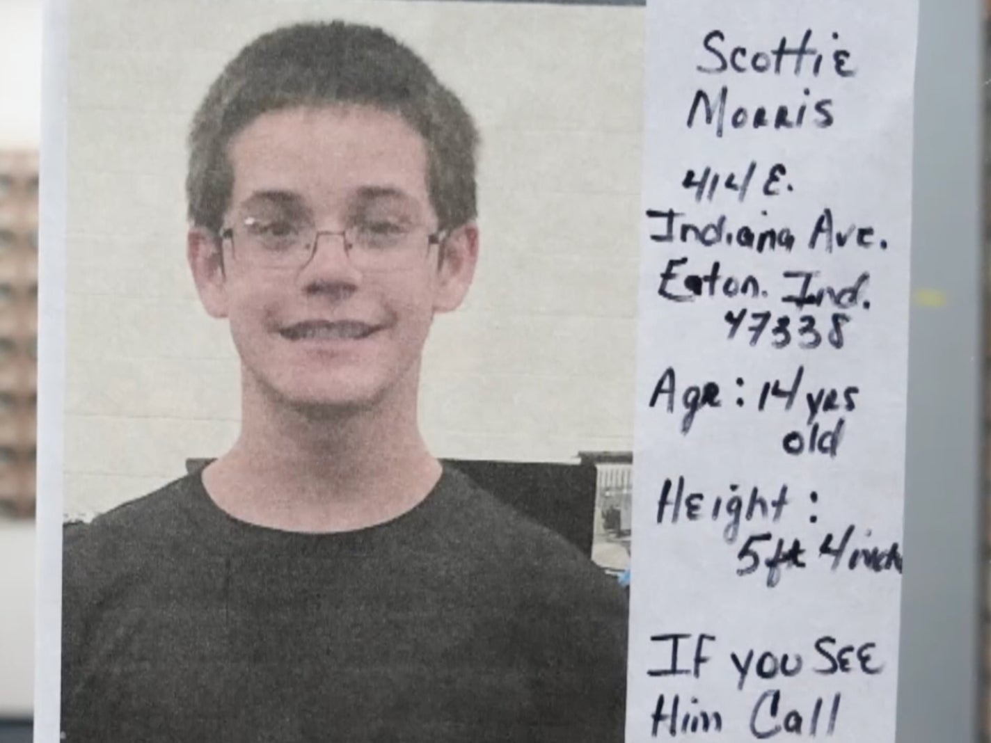 A poster shows missing 14-year-old Scottie Morris