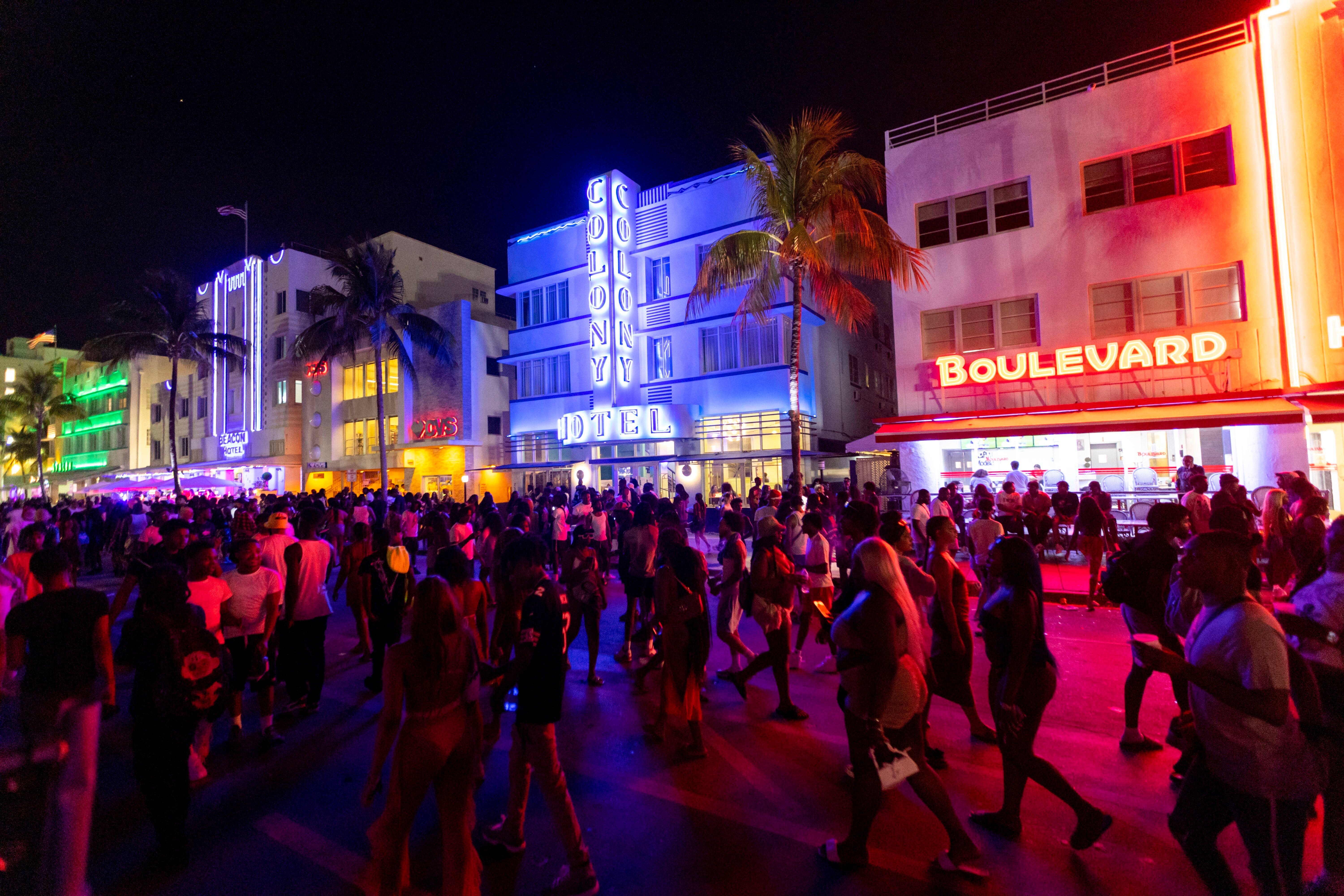 Crowds walk up and down Ocean Drive during spring break on Saturday in Miami Beach