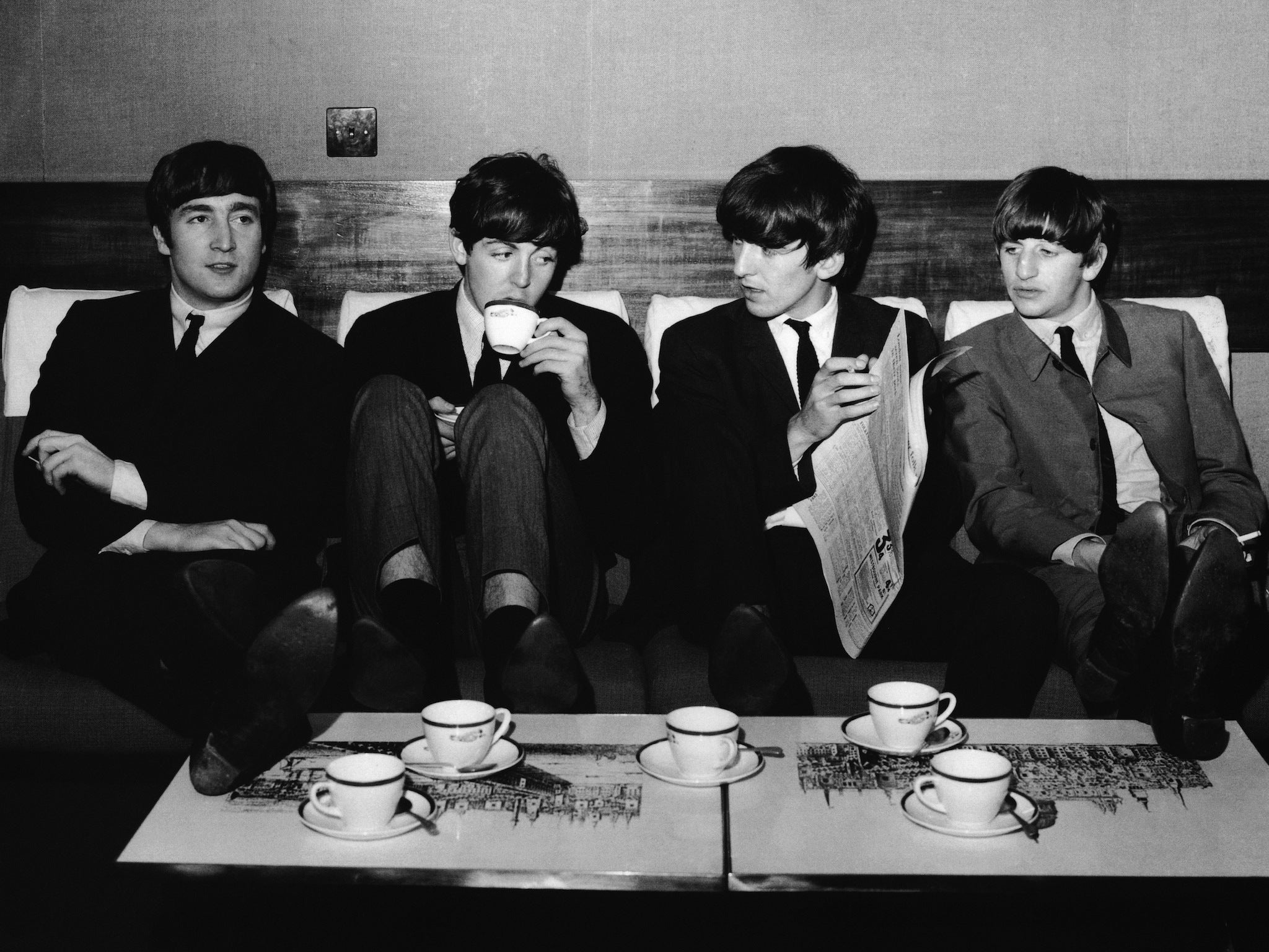 The Beatles take a break from their rehearsals for the 1963 Royal Variety Performance with a coffee after lunch at the Mapleton Hotel. From left: John Lennon, Paul McCartney, George Harrison and Ringo Starr