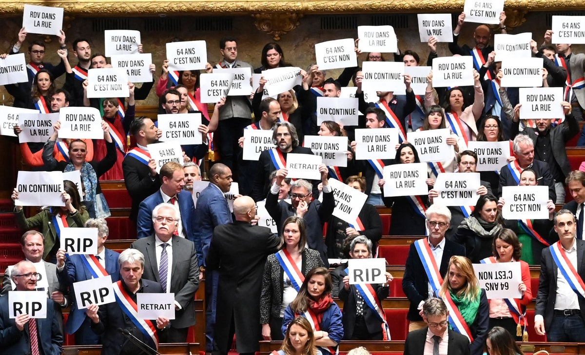 Macron survives no-confidence vote but strikes and protests to continue across France