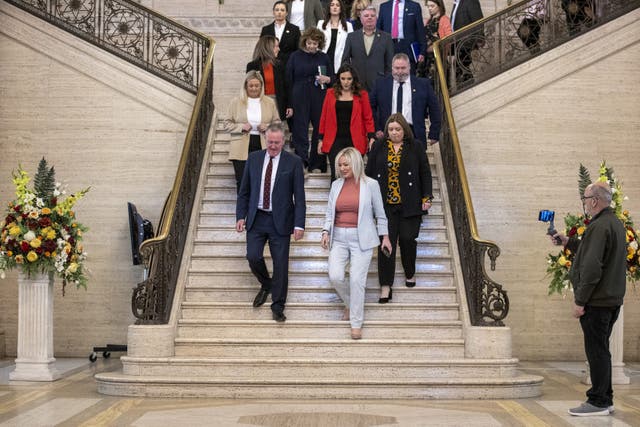 Sinn Fein Vice-President Michelle O’Neill leads her party colleagues into the Great Hall of Parliament Buildings at Stormont (Liam McBurney/PA)
