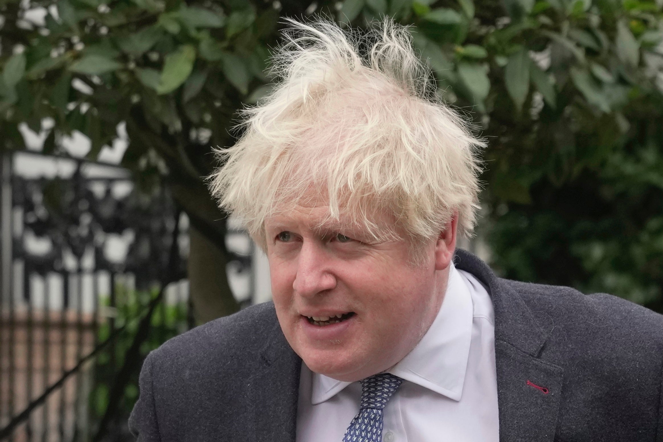 Boris Johnson outside his home on Tuesday as he prepares for grilling