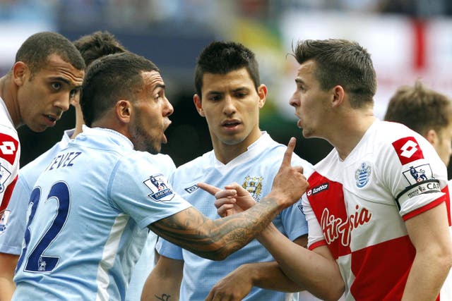 QPR’s Joey Barton argues with Manchester City’s Carlo Tevez before being sent off (Peter Byrne/PA)