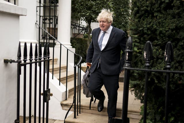 Former prime minister Boris Johnson leaves his home in London (PA)