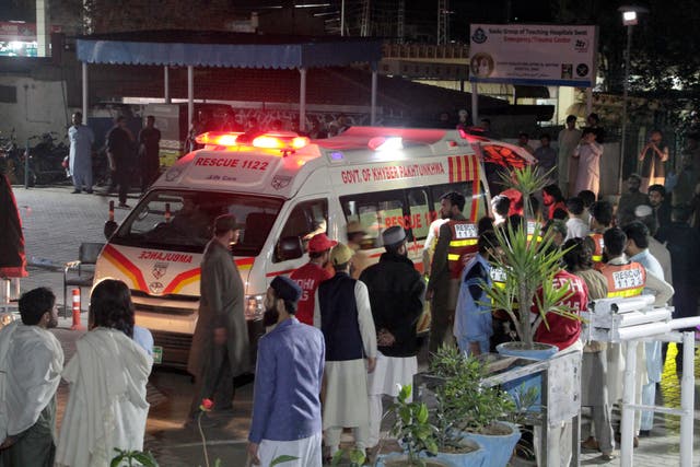 <p>Rescue worker unload earthquake victims from an ambulance at a hospital in Saidu Sharif, a town Pakistan’s Swat valley</p>