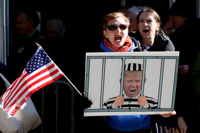 <p>Anti-Trump demonstrators protest outside the Manhattan District Attorney's office in New York City </p>