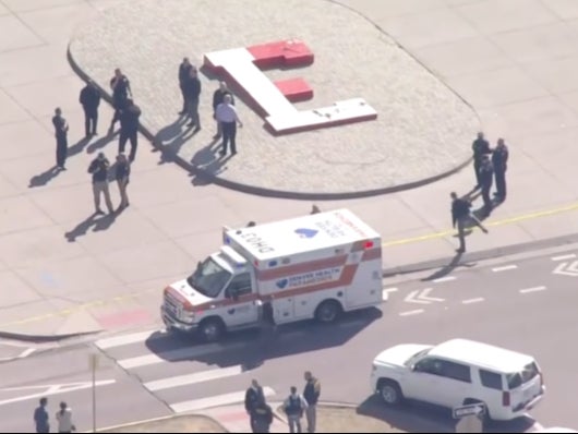 Police and first responders outside East High School in Denver after a shooter, believed to be a student, shot two faculty members