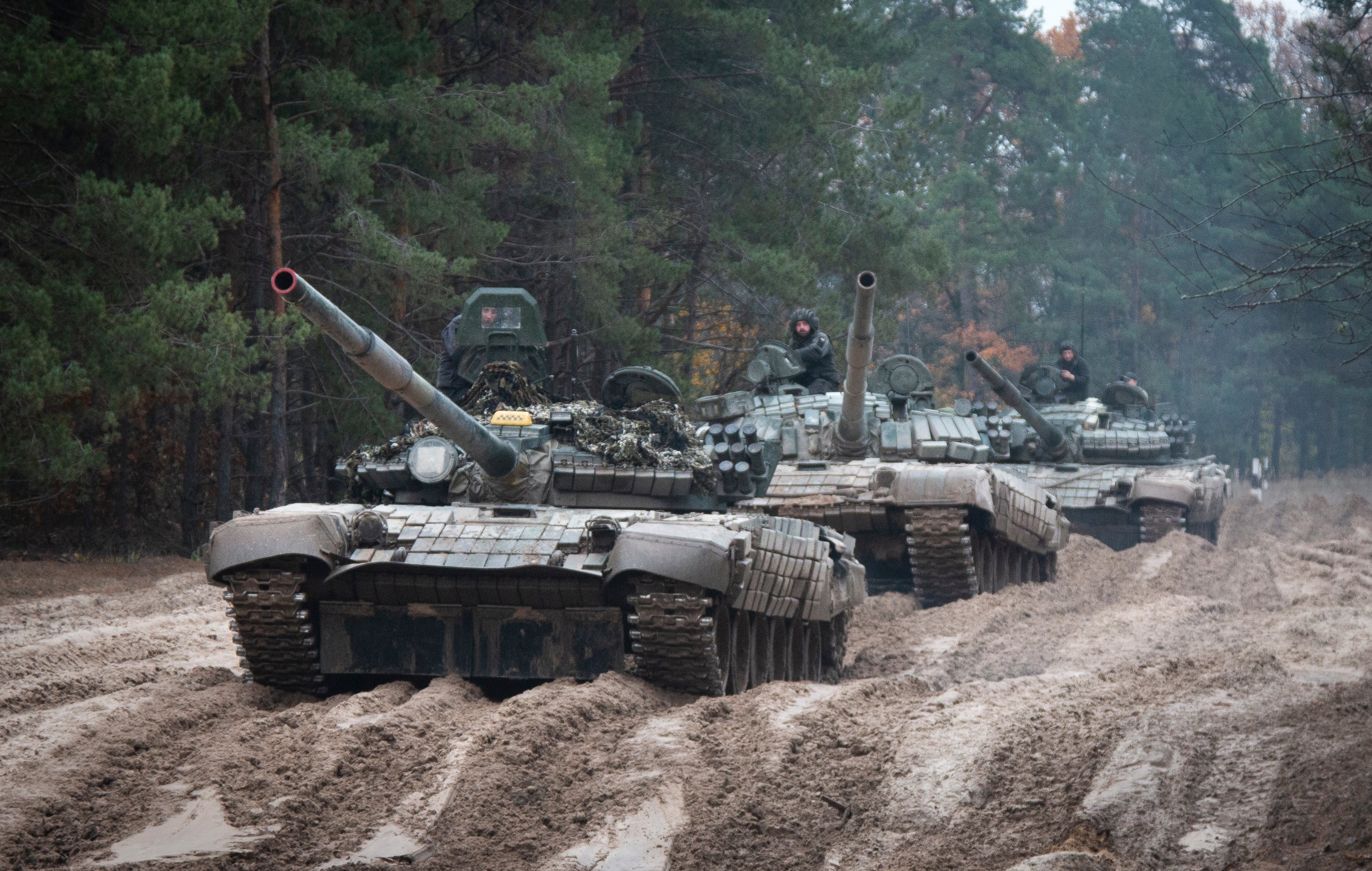 Ukrainian soldiers in captured Russian tanks T-72 hold military training close to the Ukraine-Belarus border