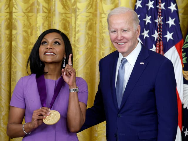 <p> U.S. President Joe Biden awards actress Mindy Kaling a 2021 National Medal of Art during a ceremony in the East Room of the White House on March 21, 2023</p>