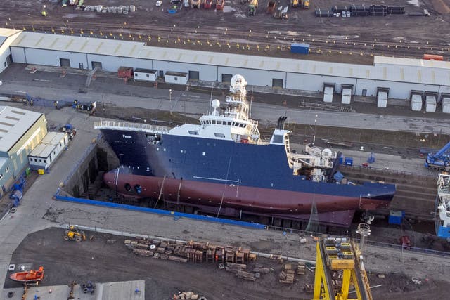 The ship Petrel toppled on to its side at Imperial Dock in Leith, Edinburgh (Jane Barlow/PA)