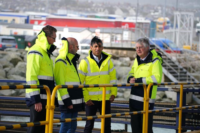 (left to right) Secretary of State for Wales David TC Davies, Stena Line chief operating officer Fleet and Government Affairs Ian Hampton, Prime Minister Rishi Sunak and First Minister of Wales Mark Drakeford during a visit the Port of Holyhead in Anglesey, North Wales (Peter Byrne/PA)