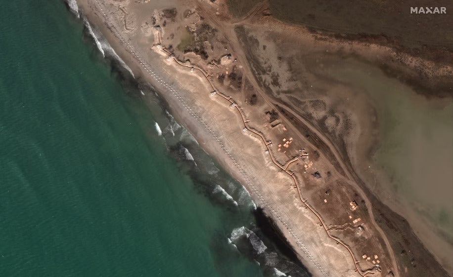 Satellite imagery taken on 12 March shows ‘dragon teeth’ fortifications and trenches along the beach in western Crimea