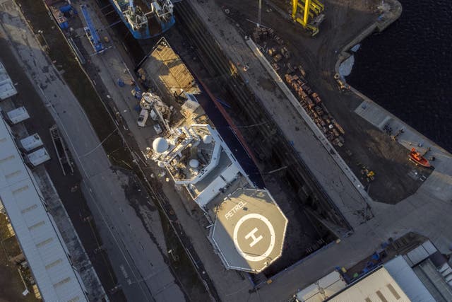 The Petrel toppled on to its side at Imperial Dock in Leith, Edinburgh (Jane Barlow/PA)