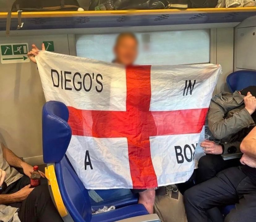 An England fan shows off the offensive flag