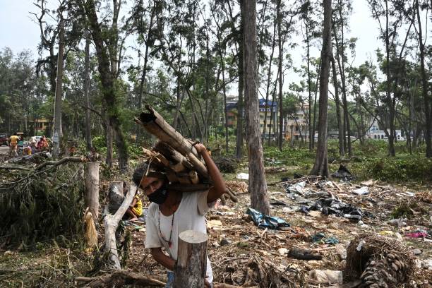 Clearing debris in Digha, some 190km from Kolkata, after Cyclone Yaas hit India’s eastern coast in May 2021