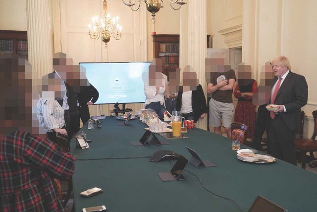 Then-PM Boris Johnson attends a gathering celebrating his birthday – in which cake and alcohol was provided – in the Cabinet Room at 10 Downing Street during the pandemic (Cabinet Office/PA)