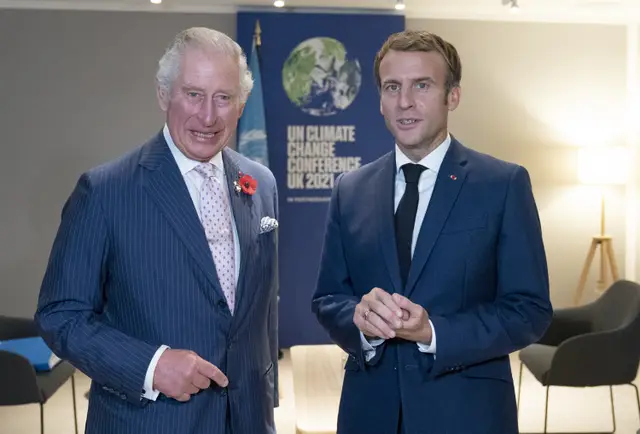 King Charles, then Prince of Wales, greeting the President of France Emmanuel Macron (right) in 2021