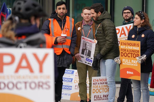 The threatened strike action in Scotland would be similar to the ongoing walkouts by junior doctor in England (Jacob King/PA)