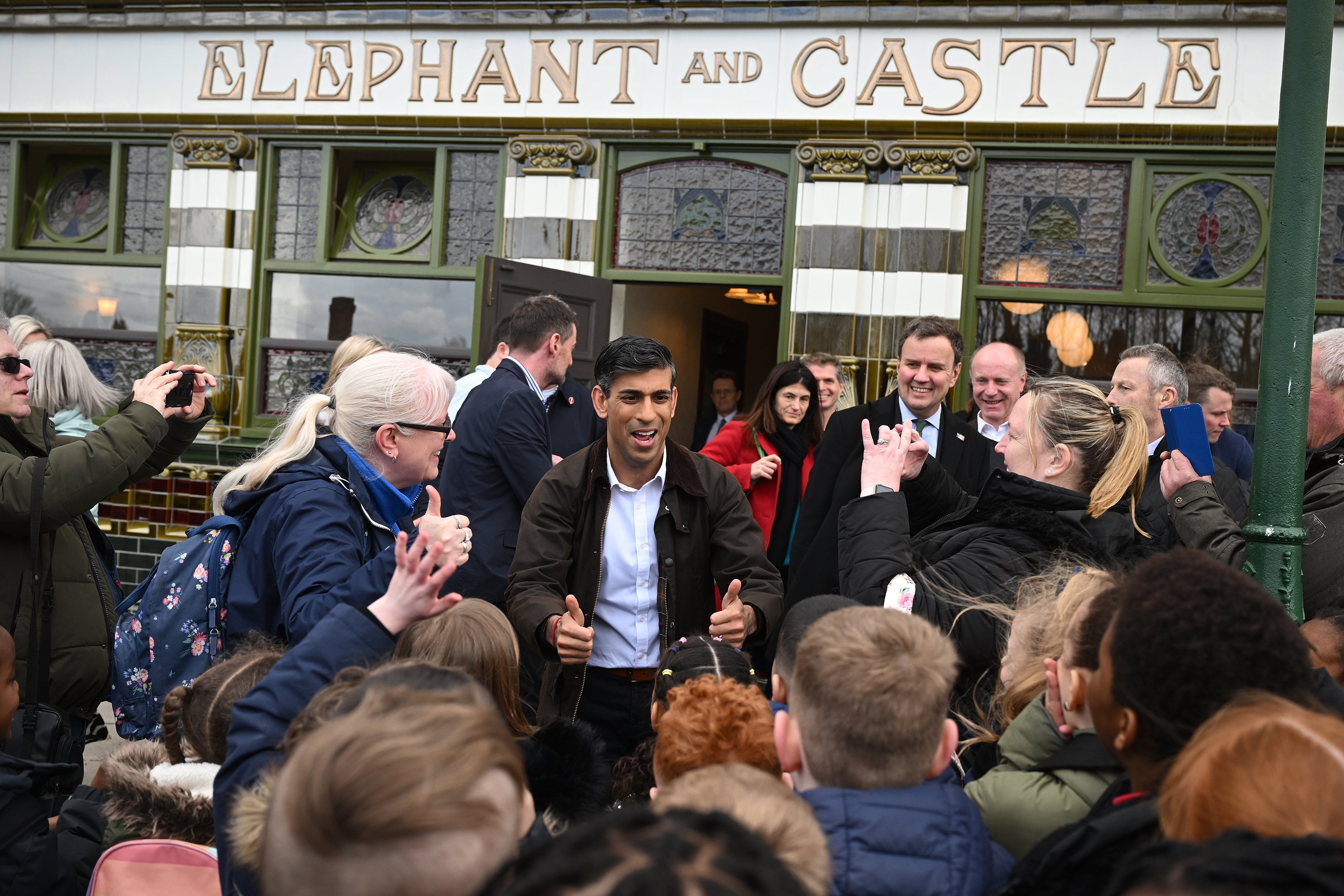 Sunak meets children outside a replica pub on a Conservative Party campaign visit to Dudley