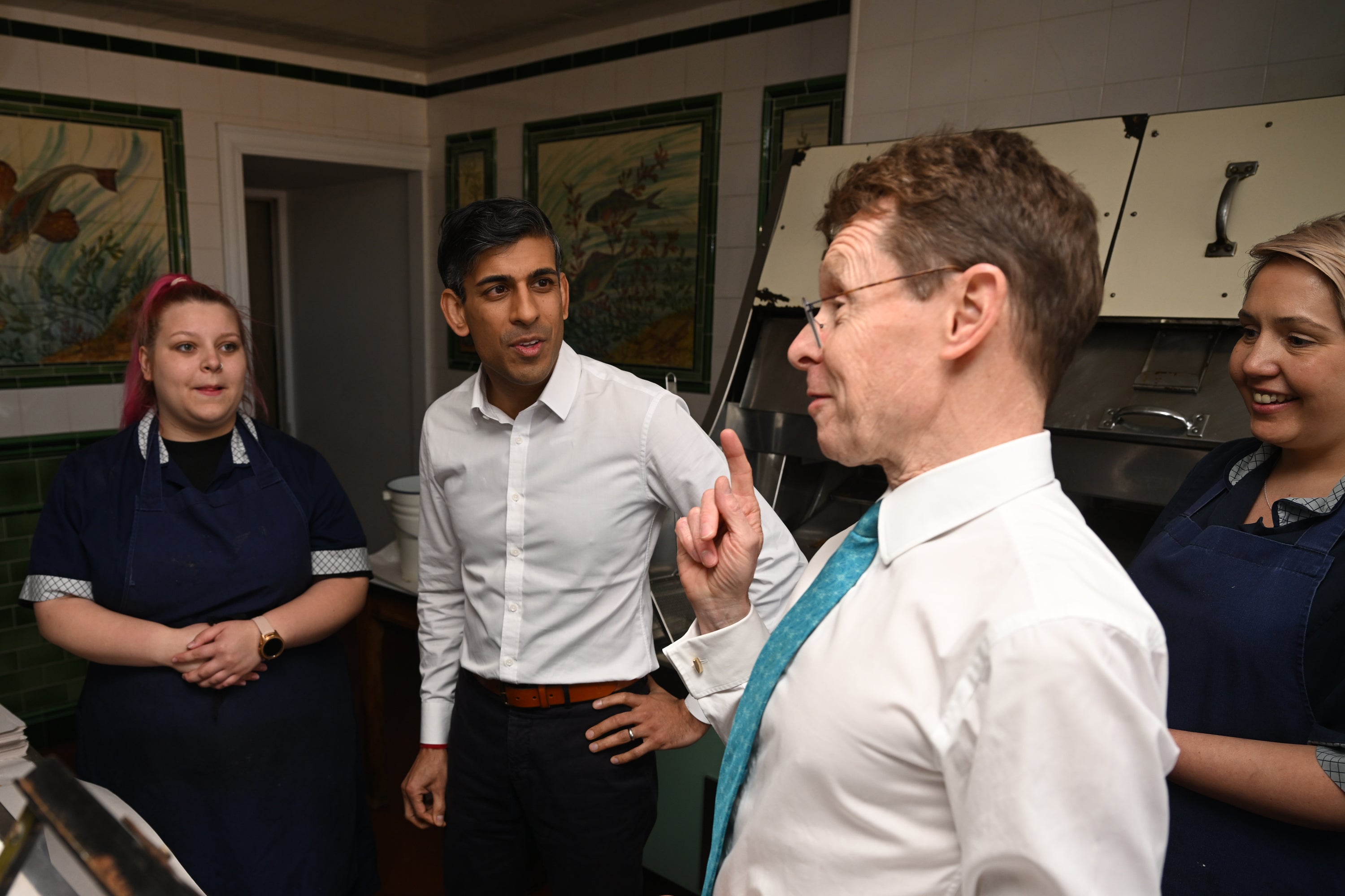 Sunak listens to Mayor Street as they visit a fish and chip shop