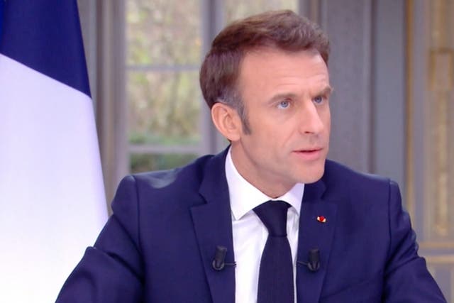 <p>Emmanuel Macron could be seen removing his watch during the televised interview</p>