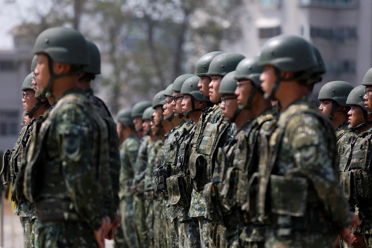 Taiwan president reviews troops ahead of US visit after Honduras setback