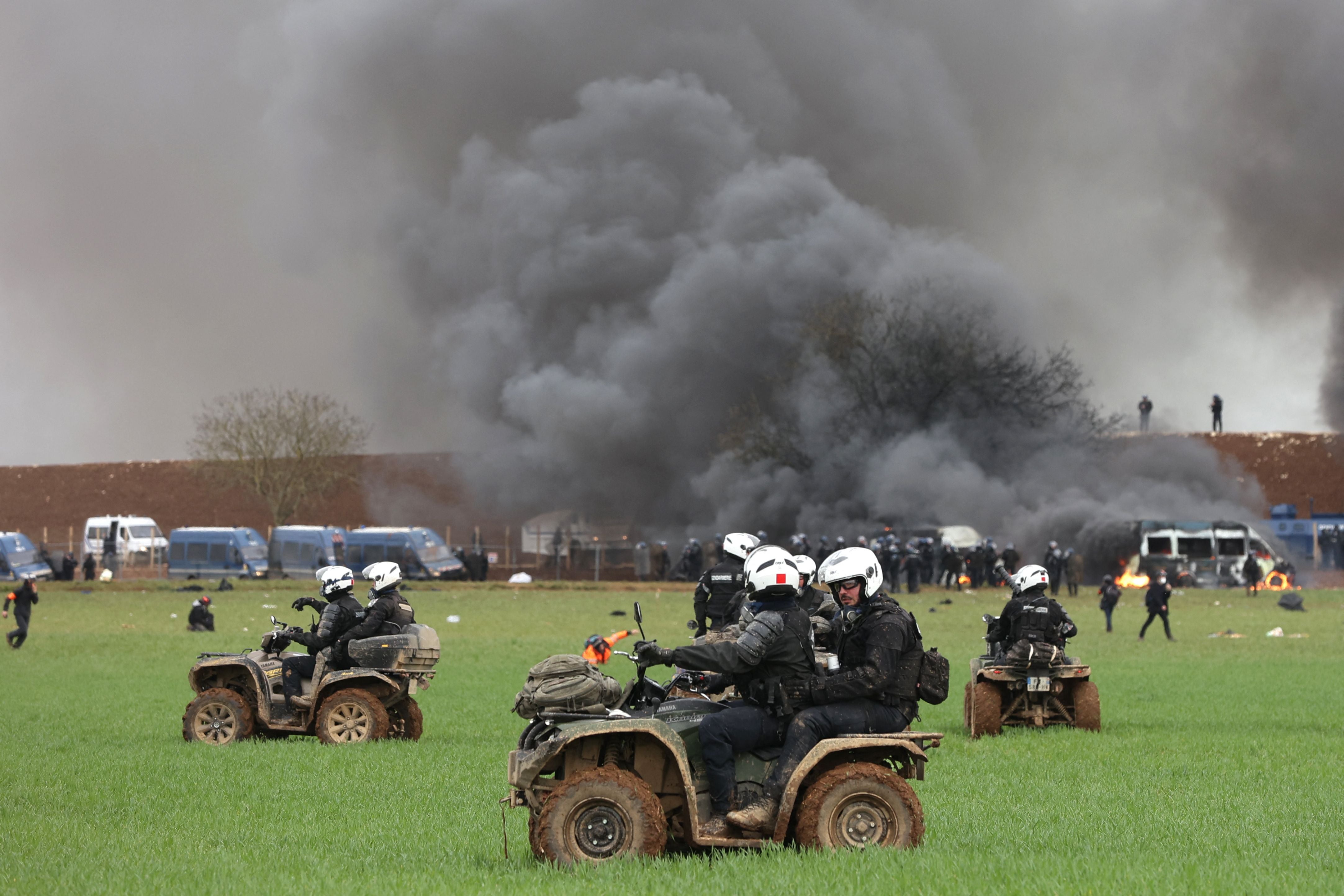 Riot mobile gendarmes, riding quad bikes, fire teargas shells towards protesters during the demonstration