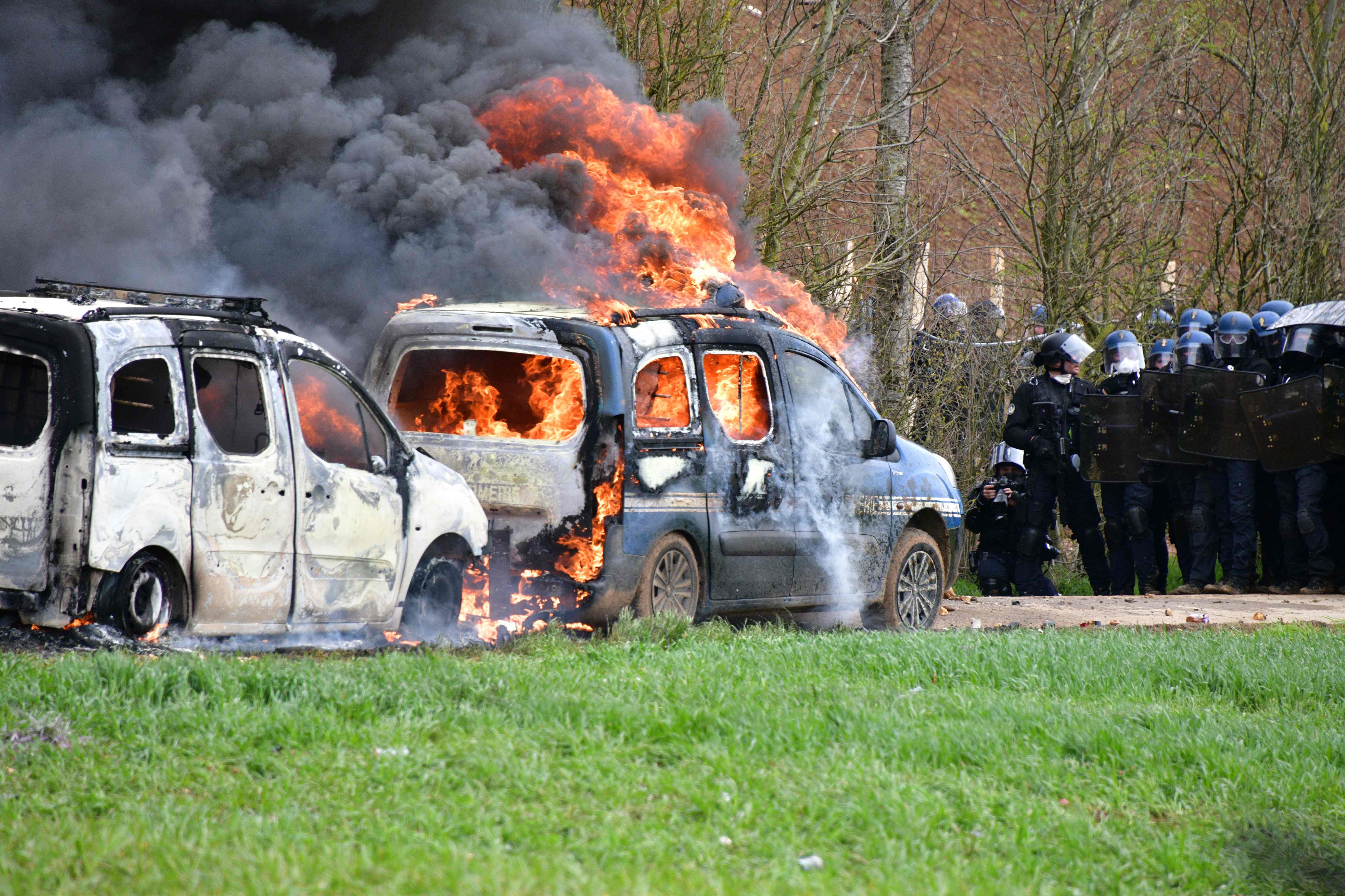 A gendarmerie vehicle burns during a demonstration in Sainte-Soline, France
