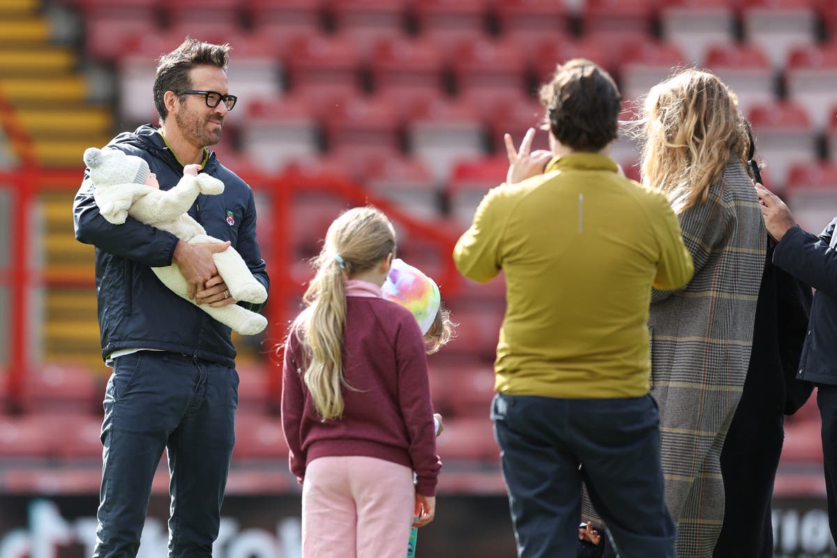 Ryan Reynolds and Blake Lively pose for photos with their newborn at Wrexham