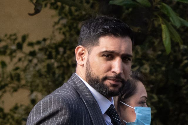 Former world boxing champion Amir Khan arrives at Snaresbrook Crown Court in east London, where three men were accused of robbing the boxer of a diamond watch at gunpoint (Jeff Moore/PA)