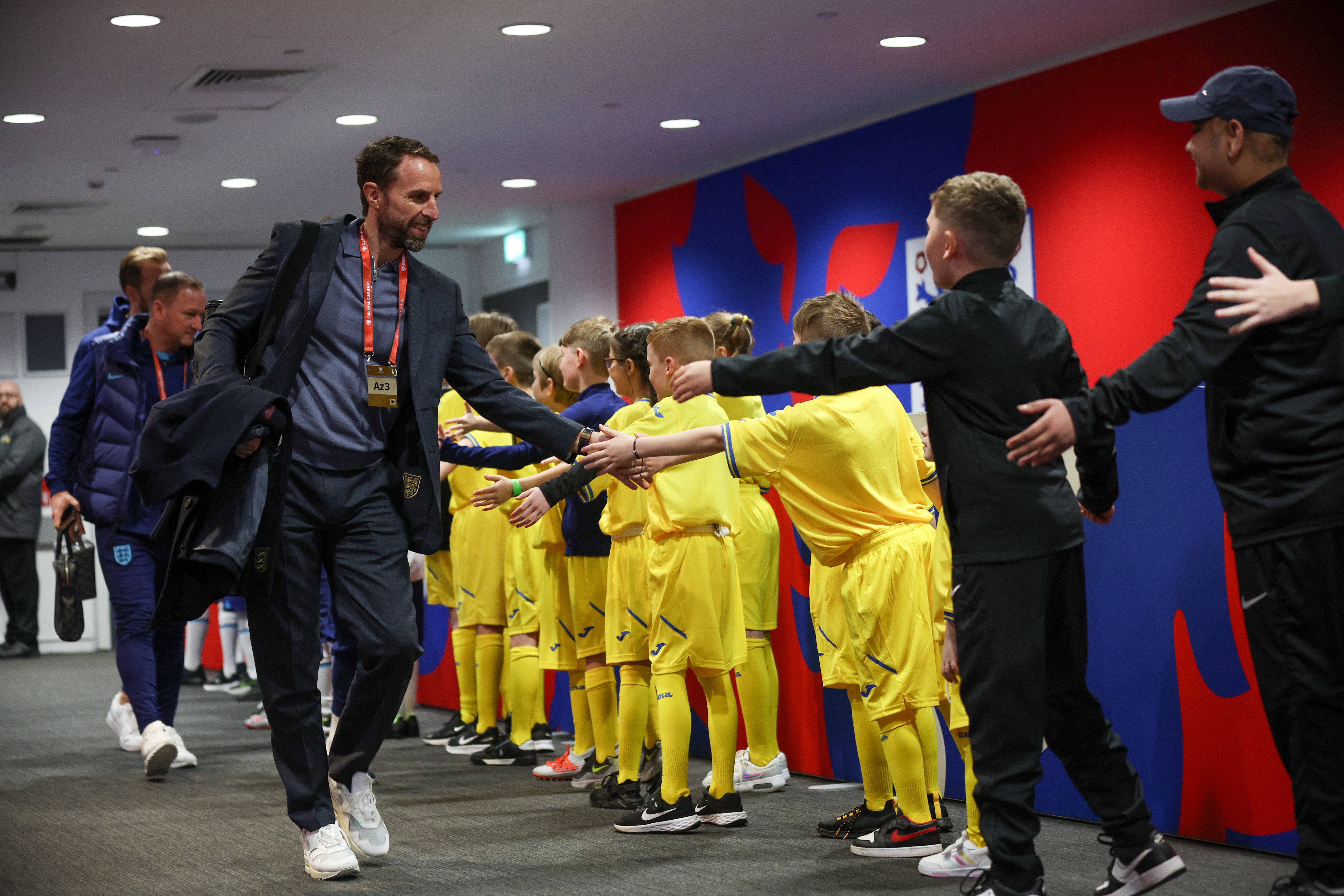 Gareth Southgate high-fives Ukraine mascots at Wembley