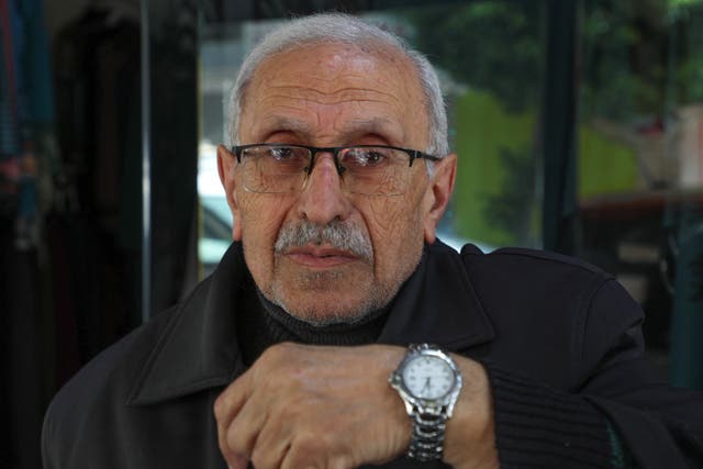 <p>Mohamed al-Arab, showing the time on his watch on Sunday, amid confusion over the clock change in Lebanon</p>