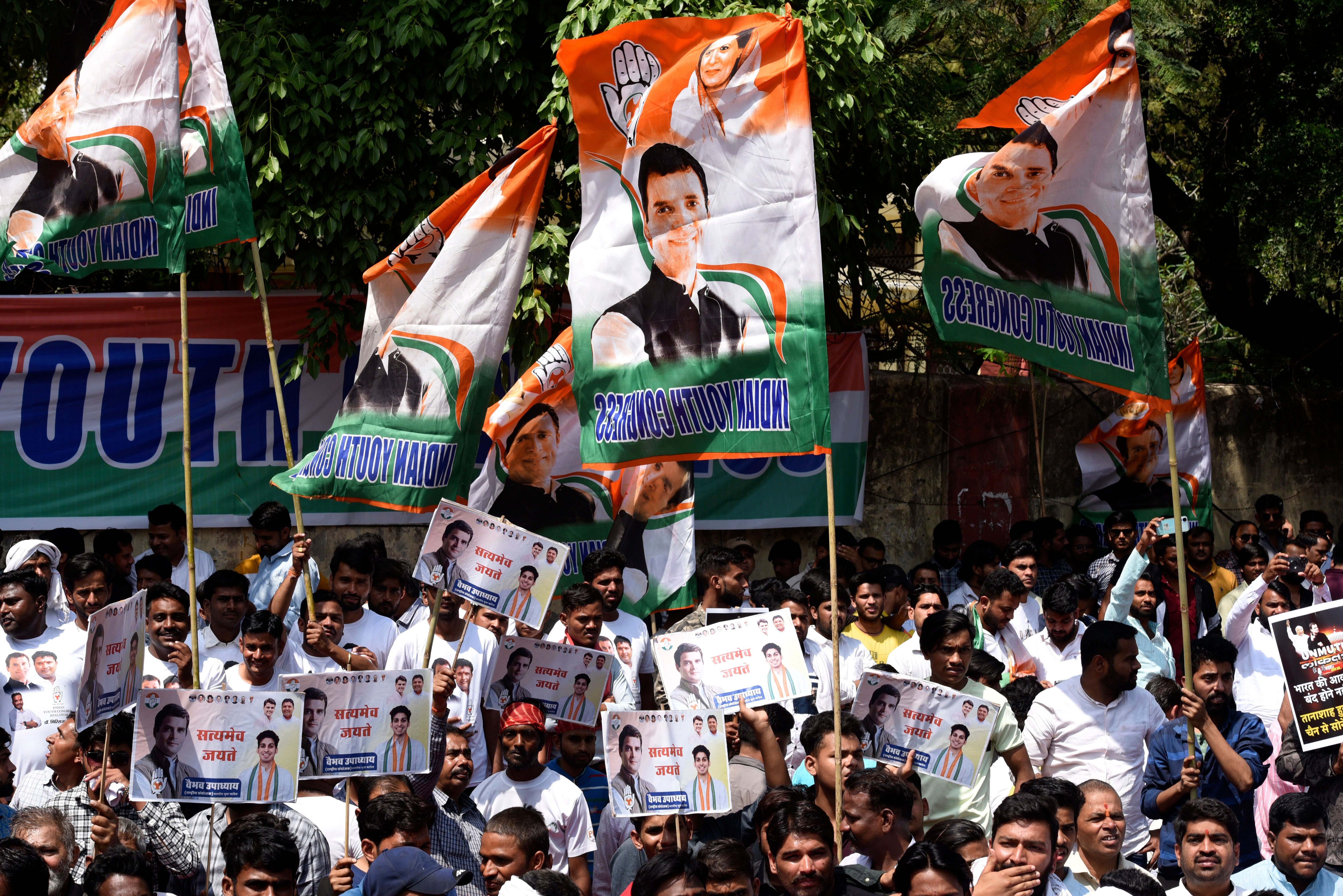 Supporters of the opposition Congress Party shout slogans as they protest against their leader Rahul Gandhi’s expulsion from parliament