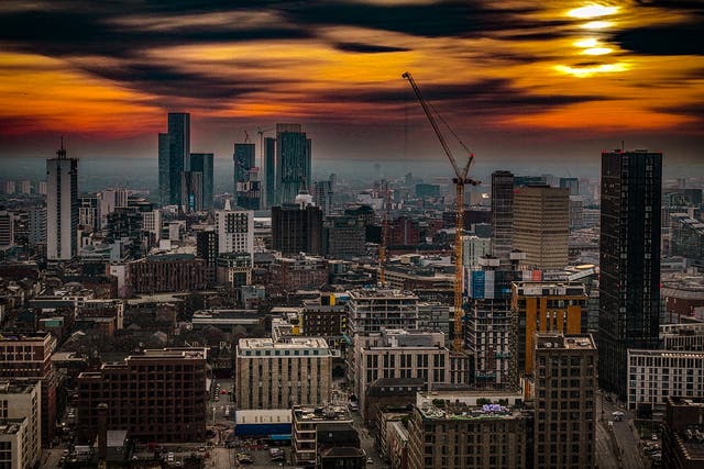 <p>Manchester skyline at sunset</p>