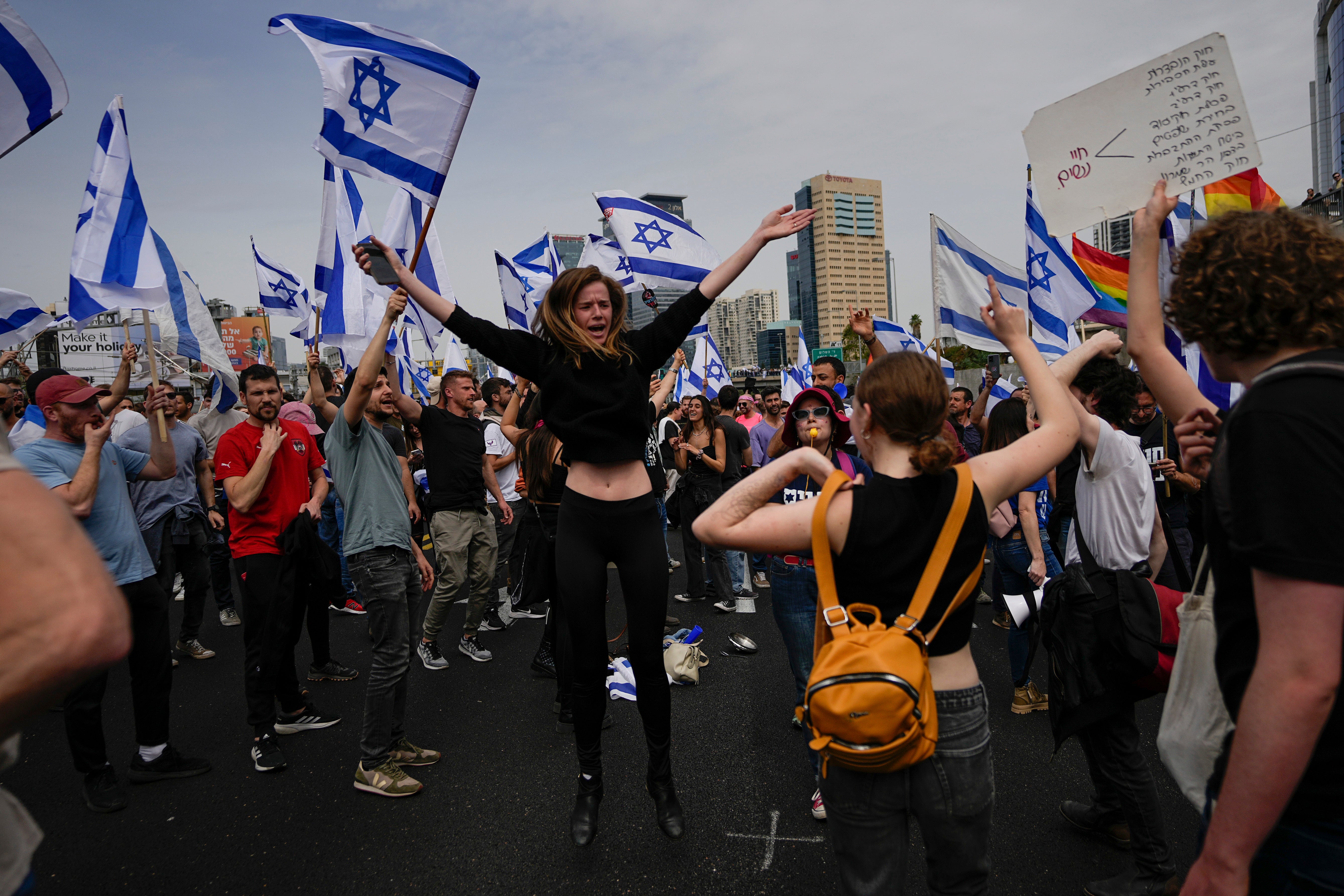 Demonstrators block a highway during protest against plans by Prime Minister Benjamin Netanyahu’s government