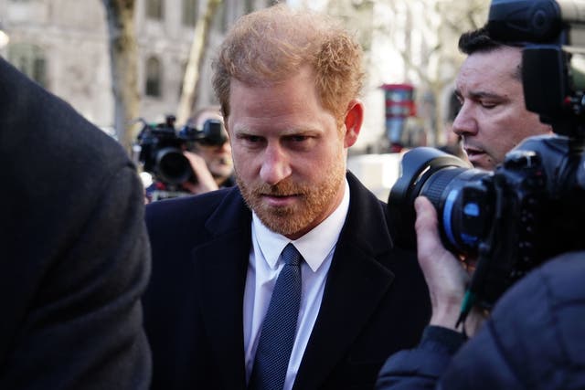 <p>Prince Harry makes his unexpected arrival at the Royal Courts of Justice on Monday</p>