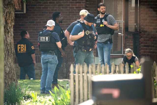 <p>Metro Nashville Police and FBI search and investigate a house in the 3000 block of Brightwood Ave. following a mass shooting at Covenant School, Monday, March 27, 2023, in Nashville, Tennessee</p>