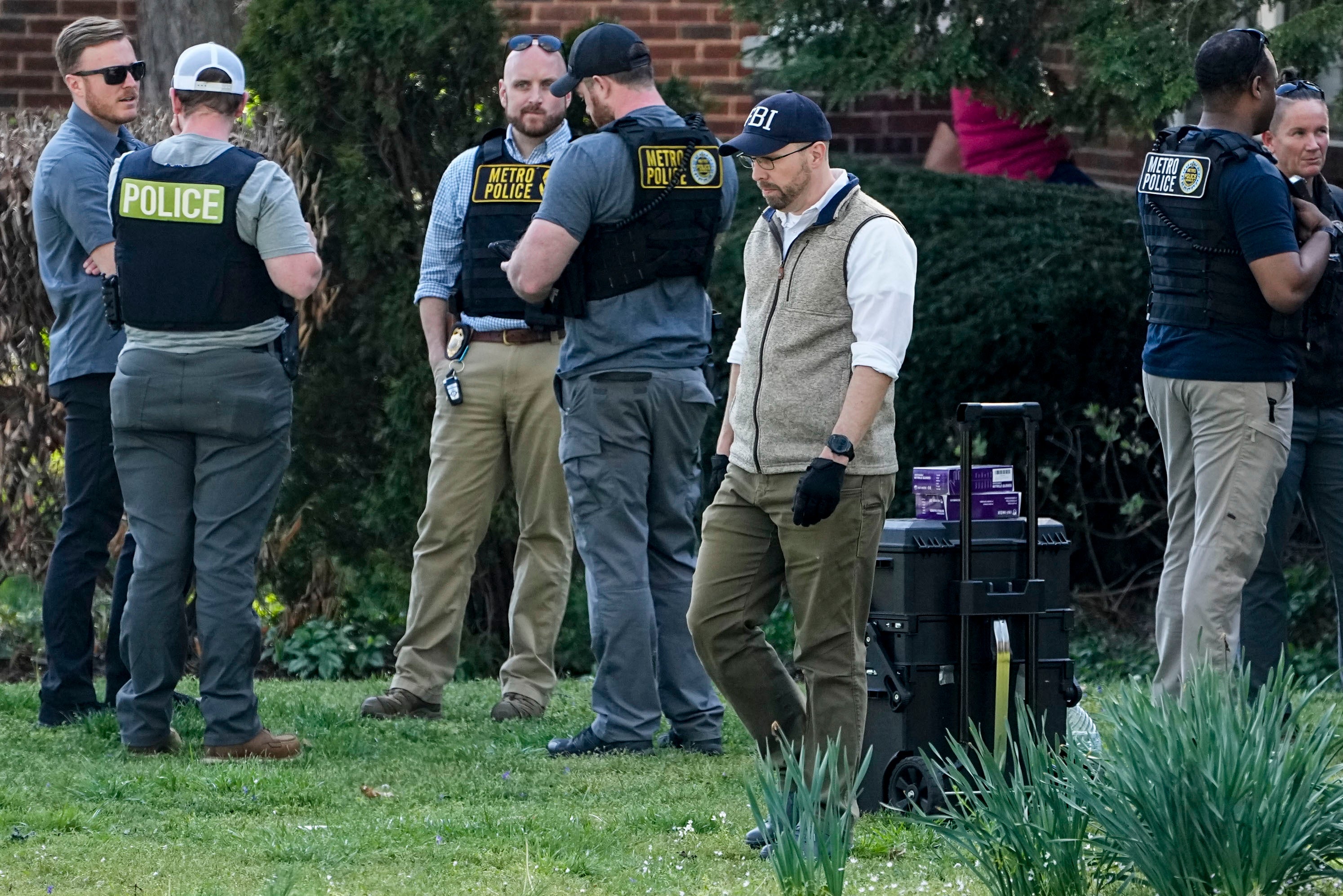 Police and FBI agents at a house in Nashville, believed to be where Audrey Hale lived