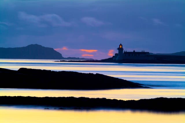 A lighthouse at dusk (Nick Kirk/Alamy/PA)