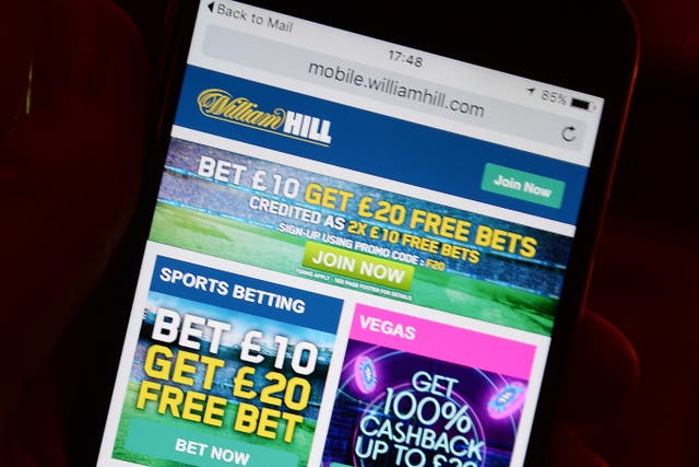 A smartphone user accesses the William Hill gambling website.