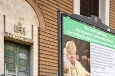 Posters near Vatican urge pope to stop Latin Mass crackdown