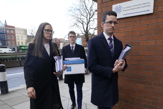 Irish teacher Enoch Burke (right), his sister Ammi Burke, and brother Isaac Burke (back) arriving at the High Court in Dublin for the legal case between Mr Burke and Wilson’s Hospital School (PA)